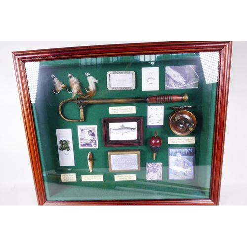 3 - A cased display of fishing ephemera and two vintage 7' fly fishing rods