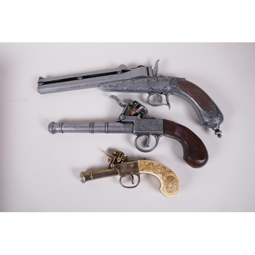 32 - Two replica flint lock pistols and a replica duelling pistol, 13