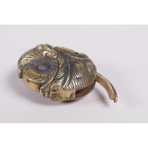 36 - A brass vesta in the form of an owl head, 1½