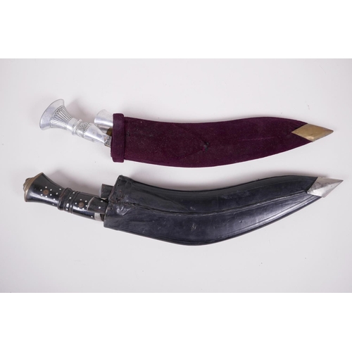 39 - Two replica Kukri knives, both in scabbards, with sharpeners, largest 17