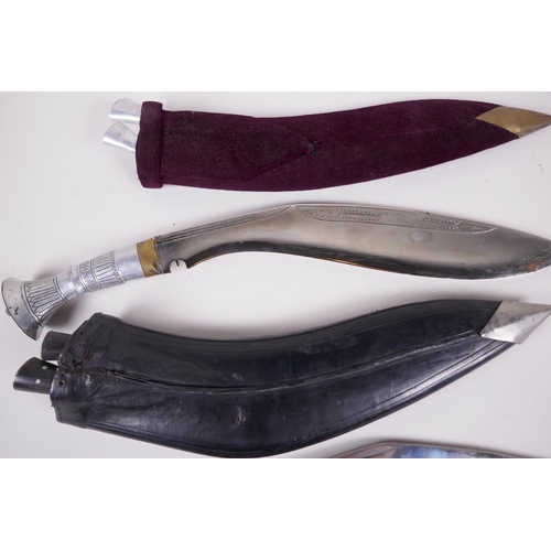 39 - Two replica Kukri knives, both in scabbards, with sharpeners, largest 17