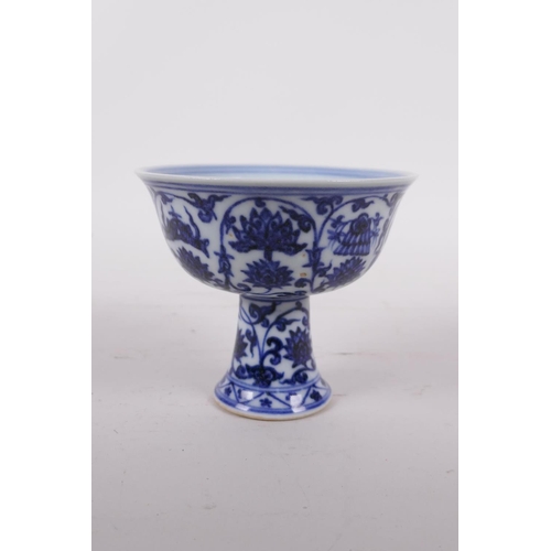 45 - A Ming style blue and white porcelain stem cup with lotus flower decoration, six character mark to b... 