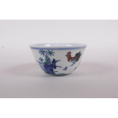 50 - A doucai porcelain tea bowl with chicken decoration, Qianlong seal mark to base, 3