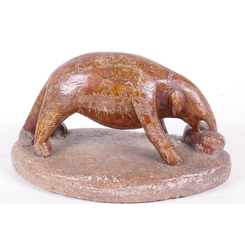 52 - An African carved soapstone figurine of an aardvark, 7