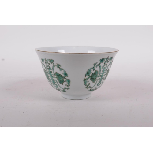 58 - An early C20th Chinese porcelain tea bowl decorated with green enamel longevity symbol, Daoguang sea... 