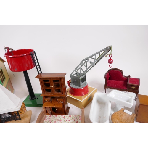 7 - Three Hornby railway items, signal box, water tank and crane, together with a quantity of dolls hous... 