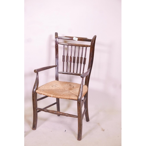 1234 - A child's William Morris style rush seated elbow chair, and another smaller