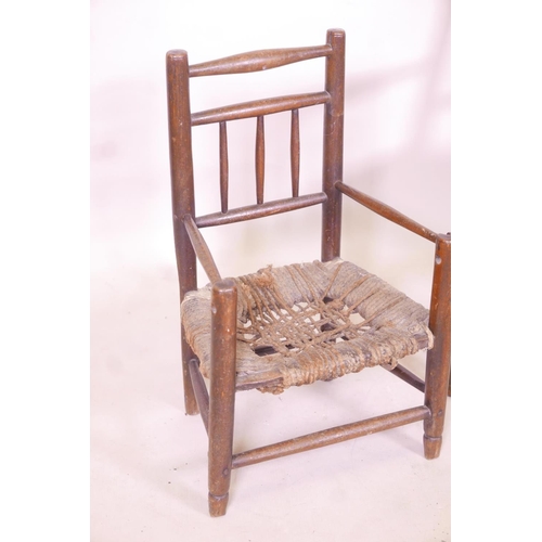 1234 - A child's William Morris style rush seated elbow chair, and another smaller