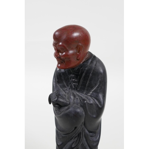 38 - A Chinese carved Zitan wood figure of Lohan with soapstone head, 6