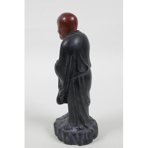 38 - A Chinese carved Zitan wood figure of Lohan with soapstone head, 6