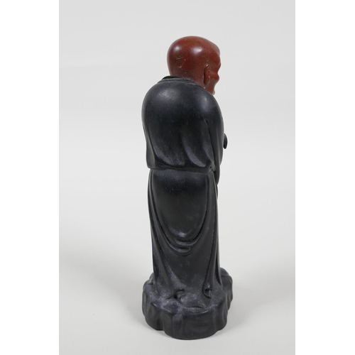 38 - A Chinese carved Zitan wood figure of Lohan with soapstone head, 6