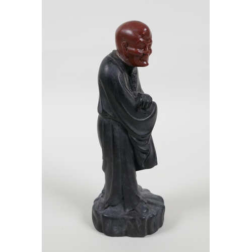38 - A Chinese carved Zitan wood figure of Lohan with soapstone head, 6