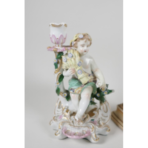 1 - A C19th Chelsea porcelain figural candlestick  modelled as a boy with a corn sheaf, 8