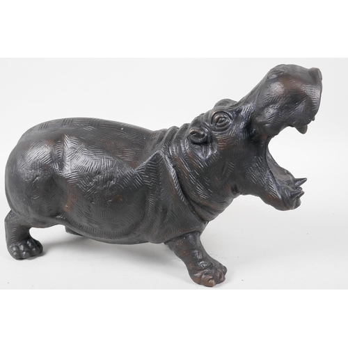 10 - A cast metal figurine of a hippopotamus with mouth agape, 15