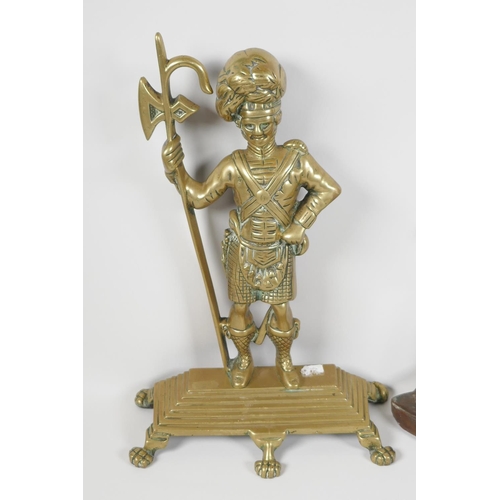 2 - A cast brass door stop in the form of a Scots Guard, 14