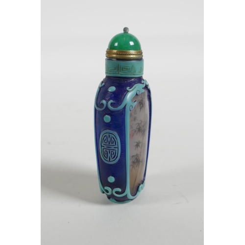 21 - A Chinese reverse decorated glass snuff bottle depicting a Chinese lady and bamboo, 3