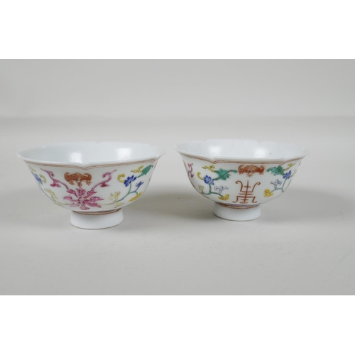 25 - A pair of early C20th Chinese polychrome porcelain tea bowls, with lobed rims and enamel decoration ... 