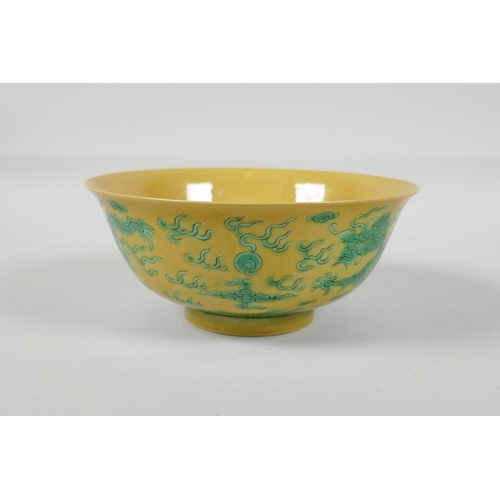 35 - A Chinese yellow ground porcelain rice bowl with incised green enamel dragon decoration, 6 character... 