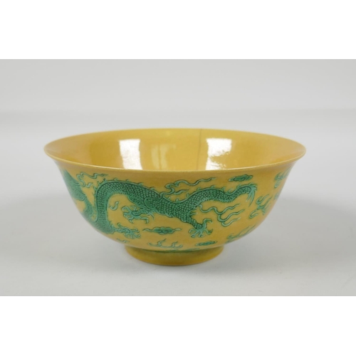 35 - A Chinese yellow ground porcelain rice bowl with incised green enamel dragon decoration, 6 character... 