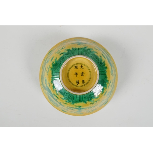 35 - A Chinese yellow ground porcelain rice bowl with incised green enamel dragon decoration, 6 character... 