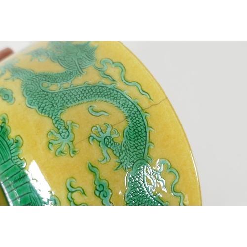 35 - A Chinese yellow ground porcelain rice bowl with incised green enamel dragon decoration, 6 character... 