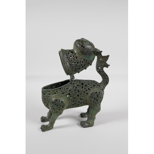 38 - A Persian pierced bronze lion censer with verdigris patina, 7