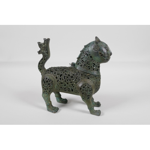 38 - A Persian pierced bronze lion censer with verdigris patina, 7