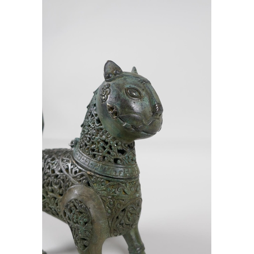 38 - A Persian pierced bronze lion censer with verdigris patina, 7