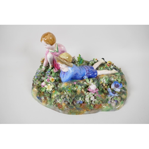 4 - A Crown Staffordshire figurine of two children in a garden, modelled by T. Bayley, A/F, 12