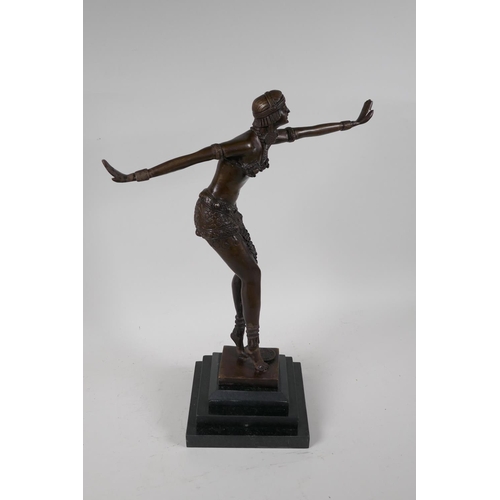 40 - A bronze figurine of a dancer, on a stepped hardstone base, after F. Preiss. 16½