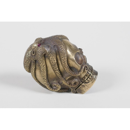 42 - A brass vesta case in the form of an octopus atop a skull