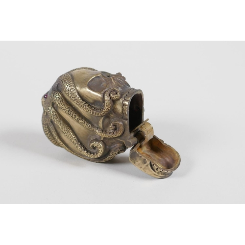 42 - A brass vesta case in the form of an octopus atop a skull