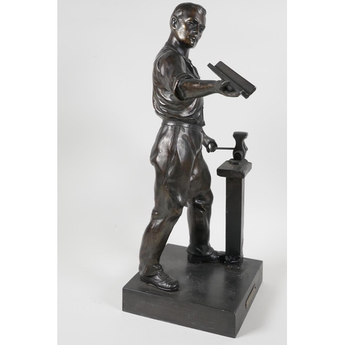 60 - A bronze figure of a metal worker, 16