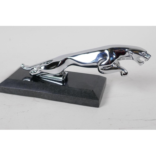 64 - A chrome plated Jaguar car mascot paper weight, on a hard stone base 8