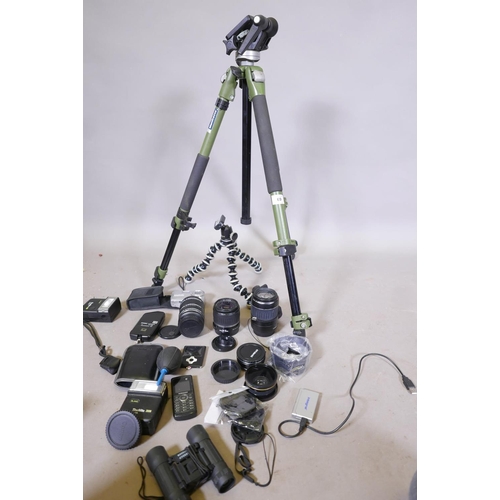 69 - A quantity of photography accessories, Canon and Polaroid lenses, Manfroto tripod etc