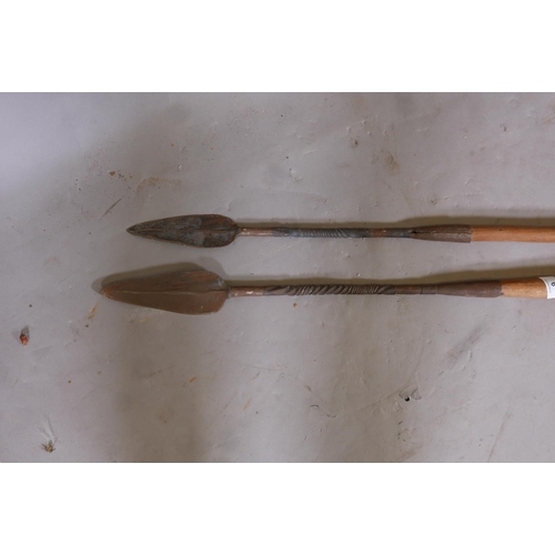 9 - An African short spear with forged metal tips, and another