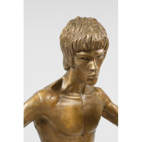 10 - A gilt bronze figure of Bruce Lee, 13