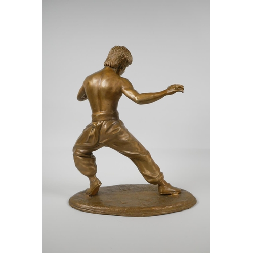 10 - A gilt bronze figure of Bruce Lee, 13