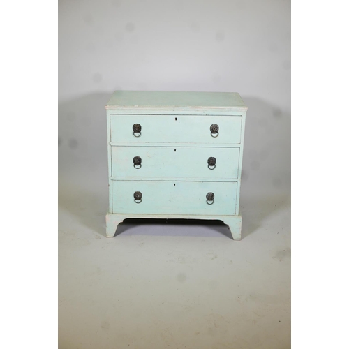 1024 - C19th painted pine chest of three long drawers, with lion mask handles, raised on bracket supports, ... 