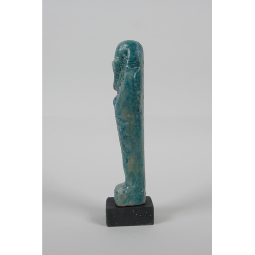 15 - An Egyptian turquoise glazed Faience Shabti, 7