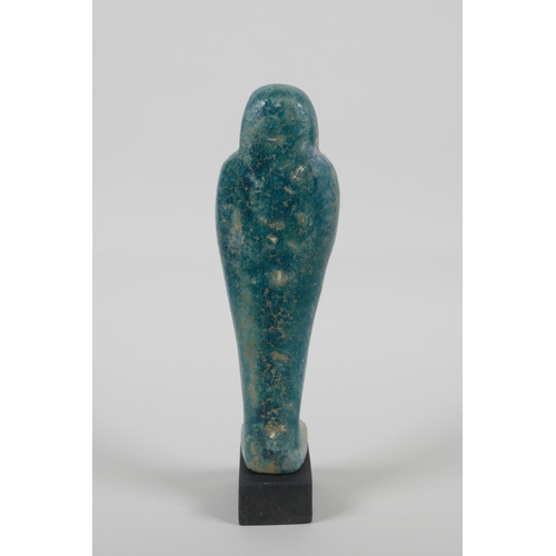 15 - An Egyptian turquoise glazed Faience Shabti, 7