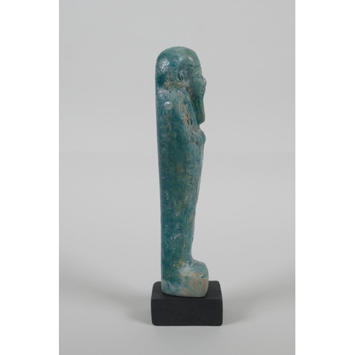 15 - An Egyptian turquoise glazed Faience Shabti, 7