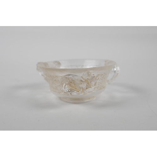 17 - A Chinese carved crystal/glass tea bowl with three kylin handles, 3½