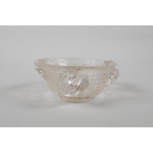 17 - A Chinese carved crystal/glass tea bowl with three kylin handles, 3½