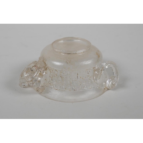 17 - A Chinese carved crystal/glass tea bowl with three kylin handles, 3½