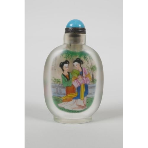 20 - A Chinese reverse decorated glass snuff bottle depicting two women in a garden to each side, 3½