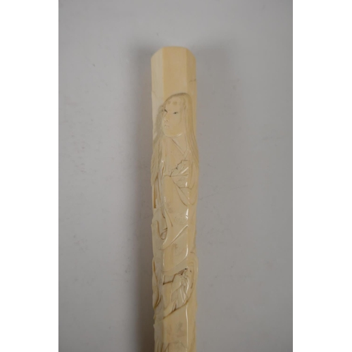 21 - A C19th Japanese carved ivory parasol handle, carved with various figures, signed with red seal mark... 