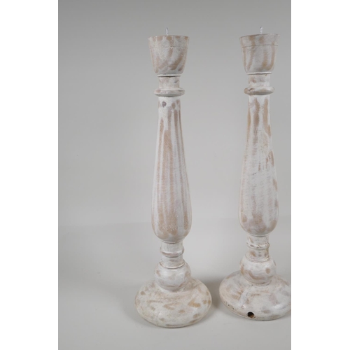 26 - A pair of turned & painted wood pricket candlesticks, 18