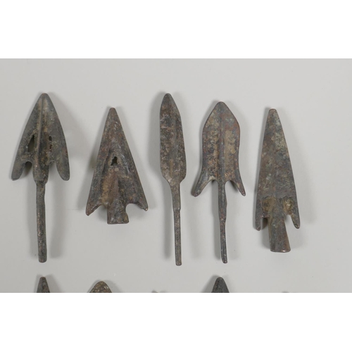 28 - Ten Archaic style bronze arrowheads, largest 3