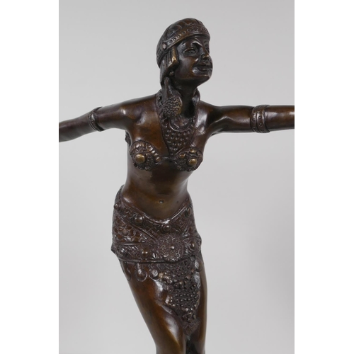 39 - An Art Deco style figurine of a dancing girl, after Preis, on a stepped base, 16½